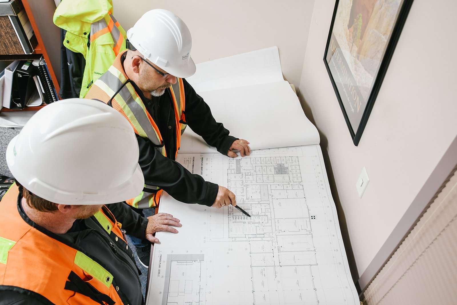 two people looking at plans