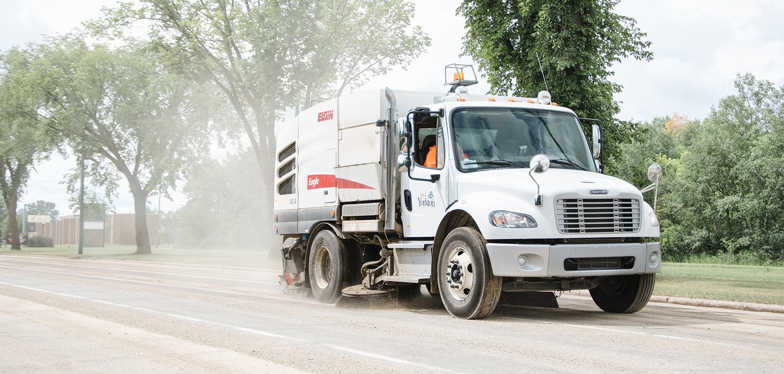 street sweeper going down road