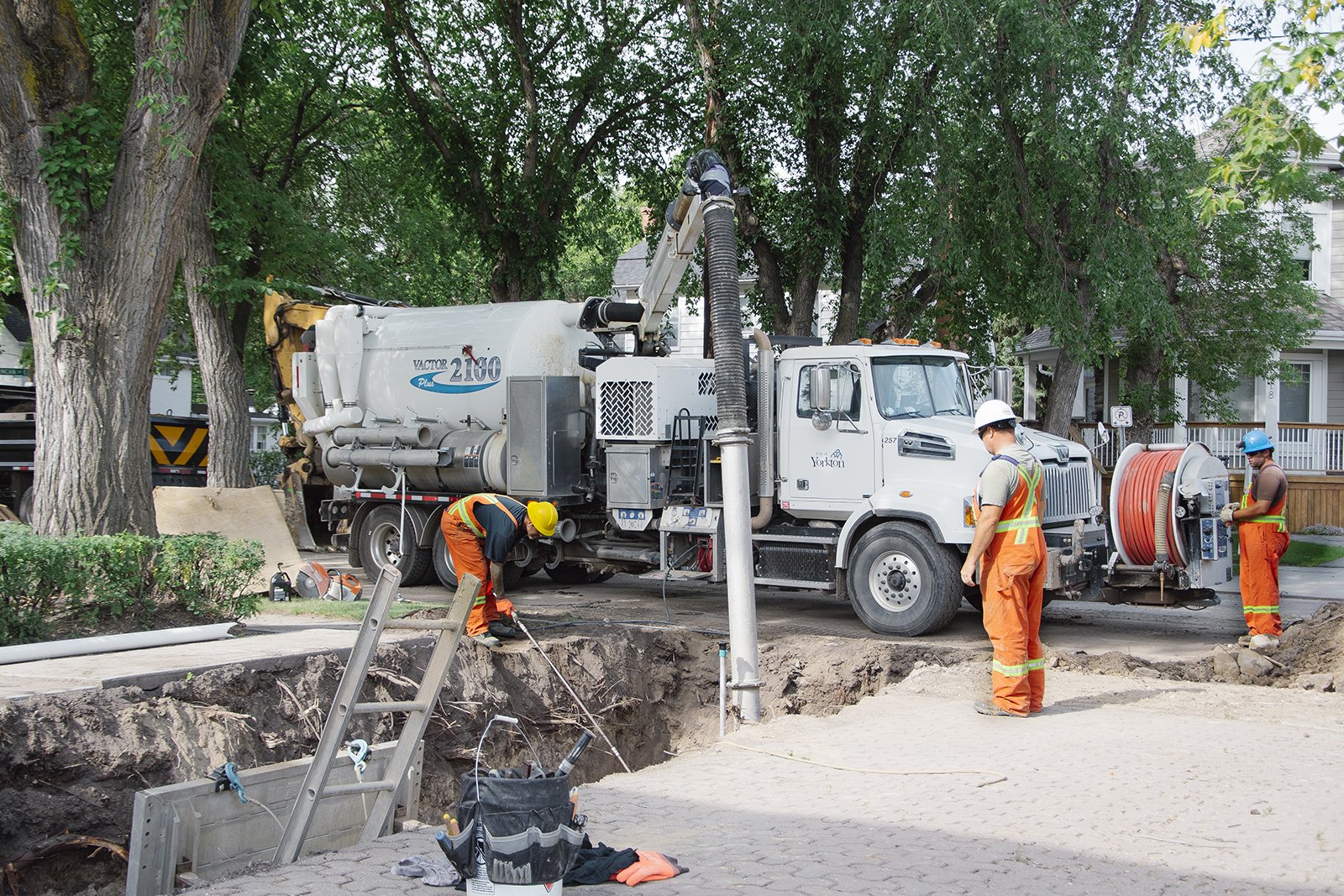 people fixing water pipes