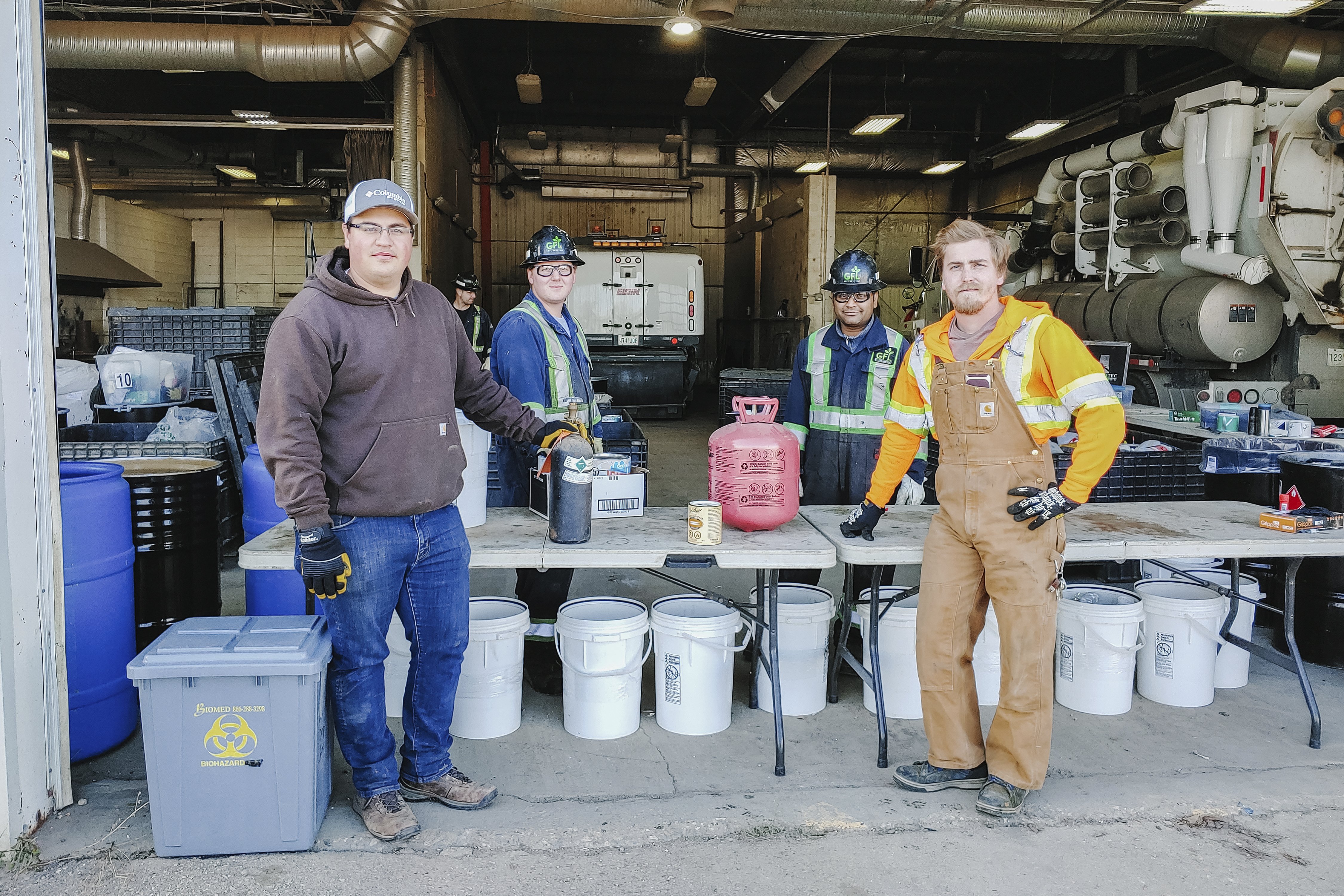 volunteers safely accepting household hazardous waste