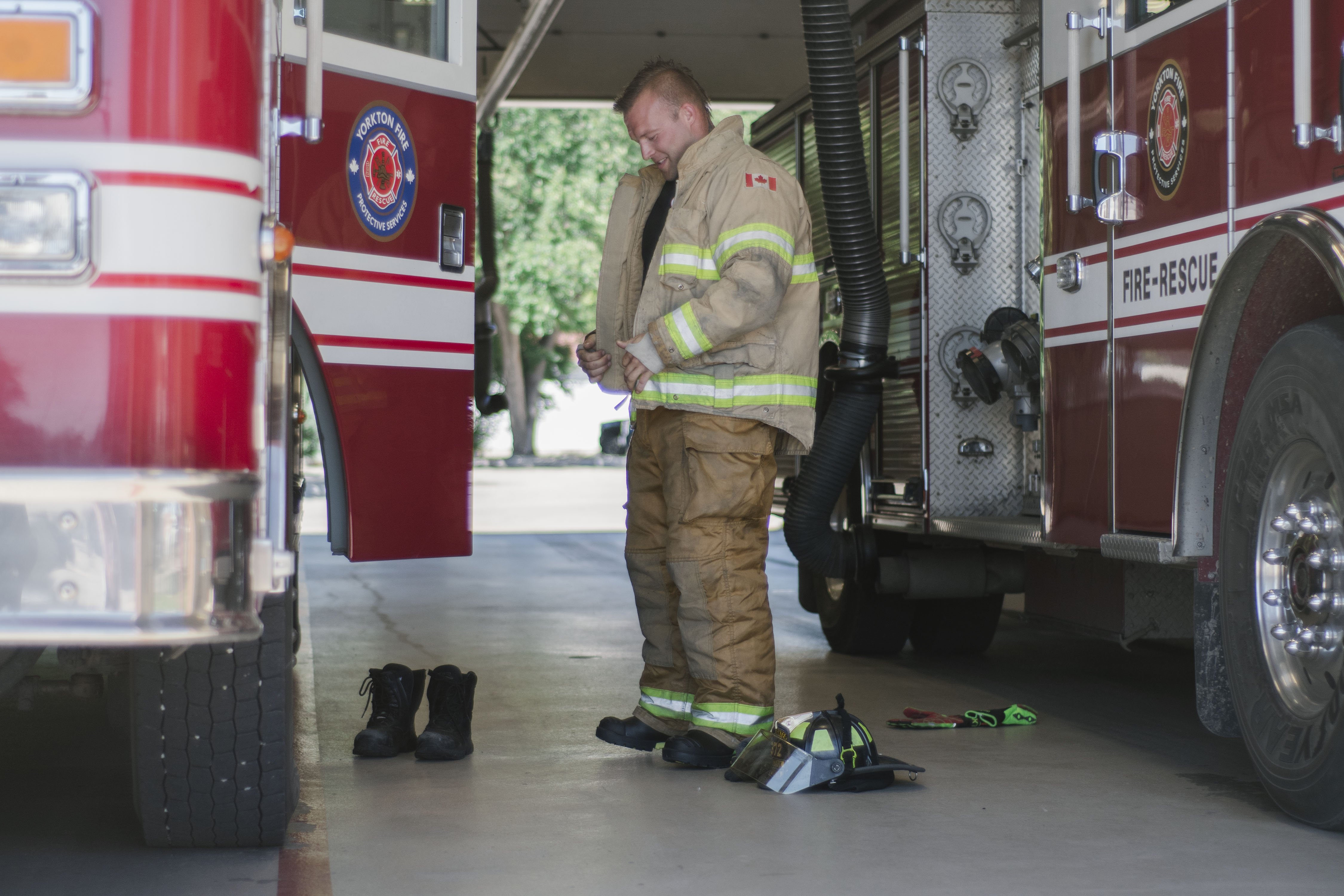 fire man putting on gear