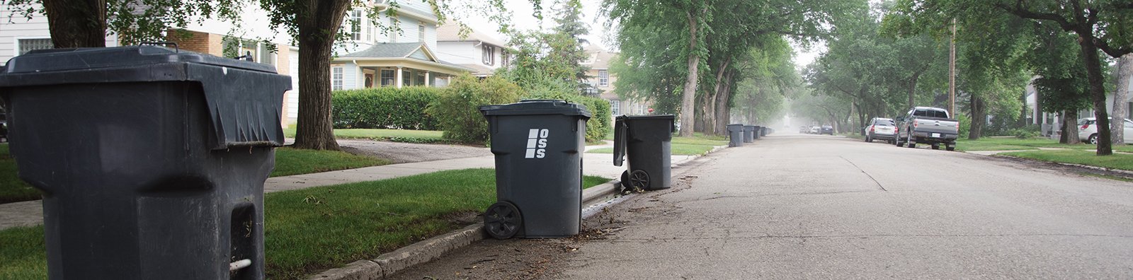 Garbage bins lined up down street