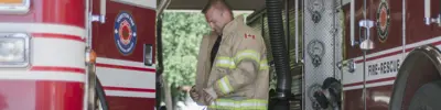 fire man putting on gear
